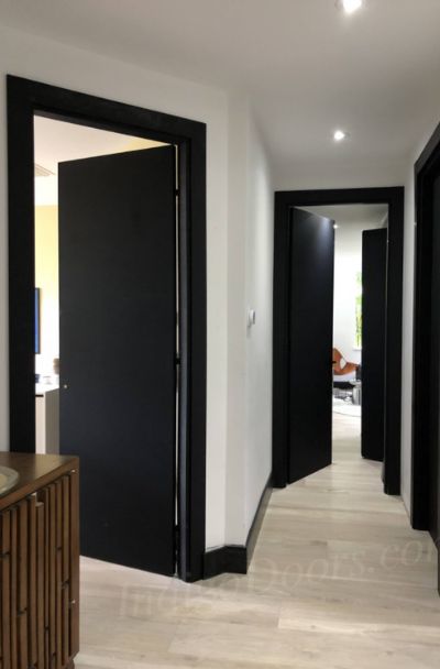 31 Black Interior Trim Ideas - | Sebring Design Build Black Baseboards, Interior Trim Ideas, Black Trim Interior, Black Interior Trim, Interior Door Colors, Black Interior Door, Black Hallway, White Hallway, Modern Hall