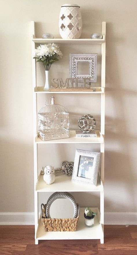 Shelf decor! Whites & neutrals. Adds dimension and life to a bland wall. Whole project costs under $70. Budget friendly! French, country, chic!!! Fake flowers and pretty frames do wonders. Thanks homegoods & Tuesday Morning!!! Paint color: Calico Cream Sherwin Williams. Calico Cream Sherwin Williams, Colorful Bookshelf, Country Chic Decor, Apt Decor, Decor Images, Wall Office, Bedroom Idea, Apartment Decorating, Tuesday Morning