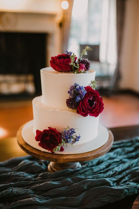 Wedding cake with red and purple flowers Wisconsin Elopement, Red And Purple Flowers, Villa Terrace, Purple Wedding Cake, Terrace Wedding, Two Tier Cake, Milwaukee Wedding, Cake Table Decorations, Wisconsin Wedding