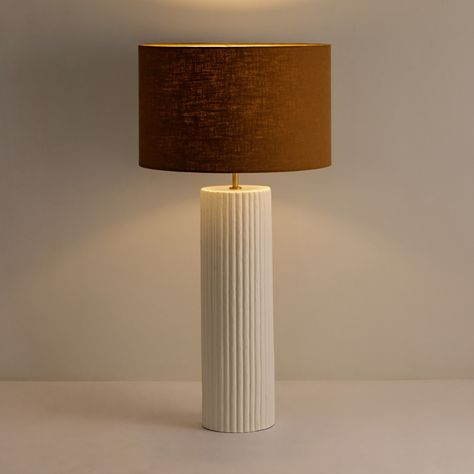 Illuminate your space with the timeless elegance of our Large Ribbed Gesso Lamp. Its textured design and classic silhouette make it a stunning addition to any room. Perfect for adding a touch of sophistication to your home decor. 🏡✨ #HomeDecor #TableLamp #InteriorDesign #ElegantLiving #elegantlivingroom Cream Table Lamps, Lamp Large, Minimalist Tables, Outdoor Mirror, Design Table, Chandelier Floor Lamp, Arm Chairs Living Room, Ribbed Texture, Lamps Ceiling