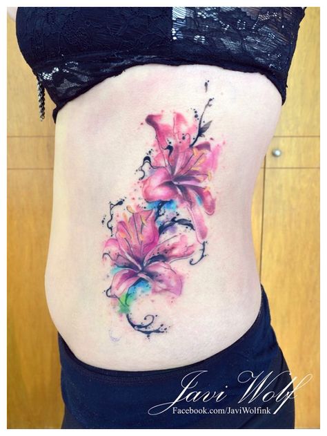 Lillies Tattoo Color, Colorful Lily Tattoo, Watercolor Tattoo Flower Lily, Watercolor Flower Tattoo Ribs, Watercolor Mountains Tattoo, Rose Tattoo On Side, Tattoo Under Chest, Purple Watercolor Butterfly Tattoo, Meaning Of Arrow Tattoo