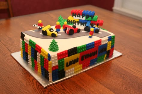 - Lego cake, chocolate and filled with choc. buttercream. A friend asked me to make this for her son and his 2 little friends, when they turned 3. The cake sides and race cars are fondant and the other toppings are gumpaste. Inspiration from http://www.creativepartyplace.com/boys/lego-birthday/ and race car tutorial from http://cakejournal.com/tutorials/how-to-make-a-race-car-cake-topper/ Easy Lego Cake, Lego Blocks Cake, Lego Race Car, Lego Torte, Car Chocolate, Race Car Cakes, Car Cake Toppers, Lego Birthday Cake, Car Cakes