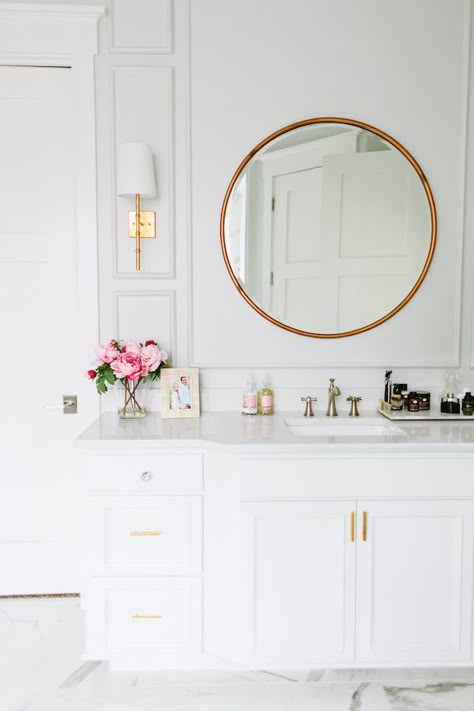 Clean, classic and sophisticated bathroom with marble floors and coutertops, white cabinets, brass mirror and gold sconces. Riverside House, Revere Pewter, Bad Inspiration, Subway Tiles, Style Deco, Studio Mcgee, Powder Rooms, Bathroom Renos, Mirror On The Wall