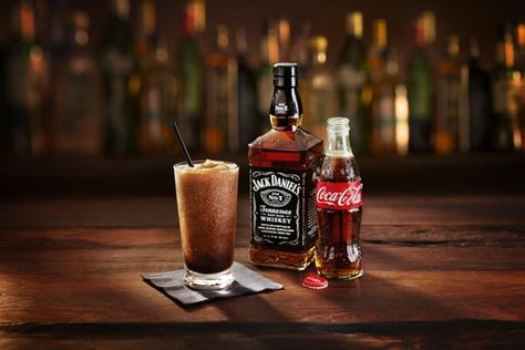 A frozen Jack & Coke cocktail accompanied by a bottle of Jack Daniel's and Coca-Cola. Coke Recipes, Jack Daniels No 7, Ribs Recipes, Jack Daniel's Tennessee Whiskey, Jack And Coke, Jack Daniels Distillery, Mixed Drinks Recipes, Tennessee Whiskey, Jack Daniel