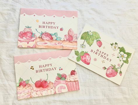 Who doesn't love strawberries? Well, these cards combine the two best things in the world: strawberries and birthdays! This is a pack of 3 unique, strawberry-themed birthday cards. Each card also comes with a translucent envelope. DIMENSIONS Width: 6 inches Height: 4 inches EXTRAS Every order comes with extras, which may consist of stickers, bookmarks, sticker sheets, washi tape, and more. SOCIALS You can follow our social media accounts for coupon codes and fun videos! Tiktok: https://www.tiktok.com/@rosieswishingstars Strawberry Birthday Card, Translucent Envelope, Birthday Card Envelope, Bd Card, Happy Birthday Drawings, Card For Girlfriend, Happy Birthday Illustration, Creative Birthday Cards, Strawberry Birthday