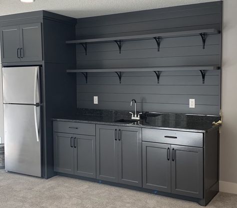 Garage With Fridge Ideas, Finished Garage Interior, Black Garage Cabinets Ideas, Garage Black Cabinets, Garage Kitchen Cabinets Ideas, Refrigerator In Garage Ideas, Garage With Cabinets, Cabinets In Garage Ideas, Black Garage Cabinets