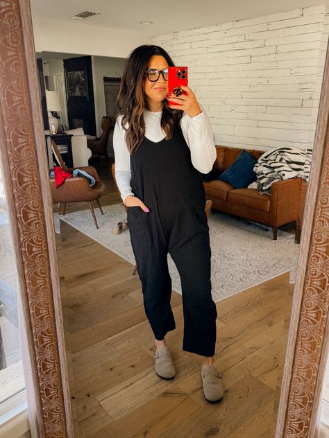 Black Outfits For Photographers, Black Jumpsuit Outfit Ideas Casual, Cute Black Jumpsuit Outfit, Black Casual Jumpsuit Outfit, Maternity Jumpsuit Outfit Winter, Jumpsuit With Long Sleeves Underneath, Black Jumpsuit Winter Outfit, Black Onsies Women Outfit Casual, Fall Jumpsuit Outfit Casual