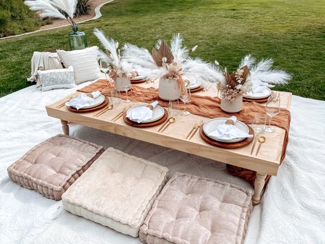 Follow Simply Creative Events on Instagram @simplycreativeevents and book your next luxury picnic in Las Vegas, NV #lasvegaspicnics #lasvegas #vegas #lasvegasevents #lasvegasparties #boho #bohopicnic #kidspicnic #picnic #bohemian #eventplanner #eventstylist #tablesettingideas #tablesetup #centerpiece #luxurypicnic Ground Picnic Table, Low Table With Pillows, Floor Picnic Table, Floor Table Seating Party, Fancy Picnic Decor, Picnic Decorations Outdoor, Pallet Table Outdoor Party, Outside Dinner Party Backyards, Outside Picnic Ideas