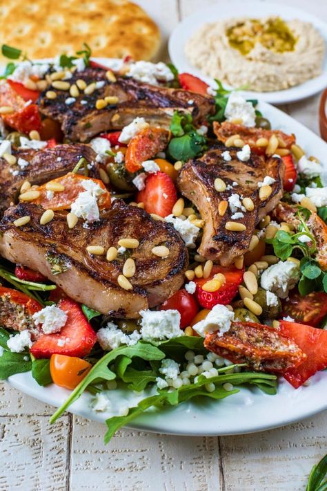 This tasty warm lamb salad recipe has all the Mediterranean vibes, as it is bursting with olives, feta and sundried tomatoes all brought together with a simple balsamic dressing. All on a crisp bed of greens and topped with perfectly grilled lamb chops. A great healthy salad to serve on a big platter for when entertaining guests. #lamb #lambrecipe #salad #mediterranean #healthy Leftover Roast Lamb, Best Mushroom Soup, Lamb Salad, Mediterranean Vibes, Marinated Lamb, Grilled Lamb Chops, Radish Salad, Easy Salmon Recipes, Grilled Lamb