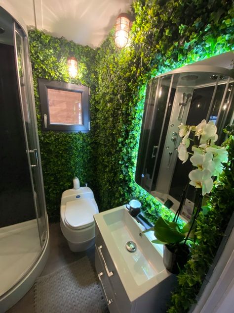 French Tiny House With A Plant Wall Bathroom And Main Floor Bedroom Plant Restroom Decor, Bathroom Ceiling Plants, Vine Wall Bathroom, Plant Ceiling Bathroom, Plant Lover Bathroom, Plant Wall For Bathroom, Greenery Wall Bathroom Ideas, Aesthetic Bathroom Themes, Living Wall Bathroom Ideas