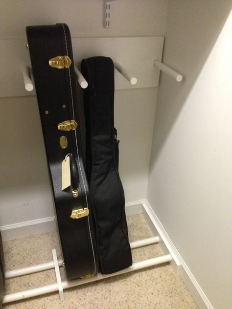 Guitar And Amp Storage, Music Instrument Storage, Guitar Closet Storage, Guitar Case Storage Ideas, How To Store Guitars, Instrument Case Storage, Instrument Storage Ideas, Violin Storage, Musical Instrument Storage