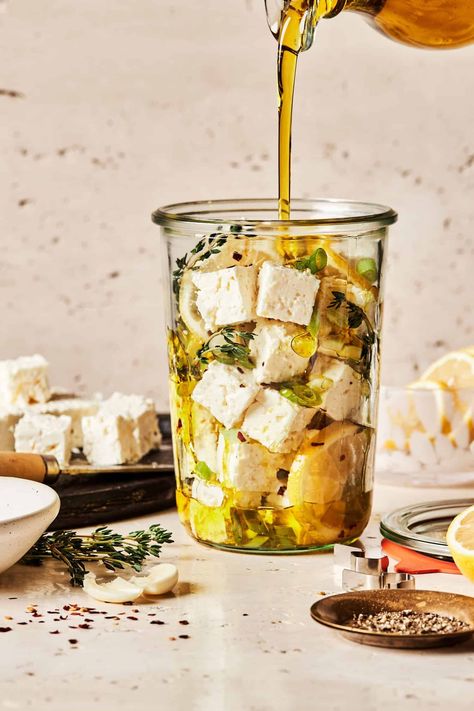 This simple and easy marinated feta recipe is the perfect holiday appetizer that comes together in only 5 minutes! A delicious holiday appetizer that comes together in only 5 minutes. This 5-Minute Marinated Feta is a simple and delicious way to enjoy feta cheese with pita chips, crackers, as part of a charcuterie board, or even on a salad! Feta Cheese Meals, Marinated Cheese And Olives In A Jar, Marinated Feta Cheese Recipes, Marinated Feta Cheese, Olive Marinade Recipe, Olive Feta Board, Marinated Antipasto, Feta Appetizer, Recipes With Olive Oil