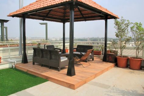 Perennial flowers around gazebo in the terrace classic style balcony, veranda & terrace by interioforest plantscaping solutions classic | homify Gazebo On Terrace Garden, Gazebo Terrace Ideas, Classic Rooftop Design, Terrace Wall Ideas, Terrace Covering Ideas, Indian Gazebo, Sitout Ideas, Balcony Roof Design, Rooftop Gazebo