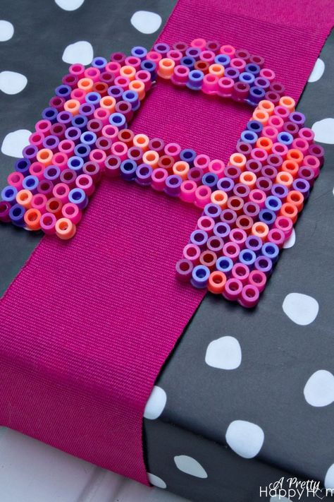 Use perler beads in an initial shape to create a personalized gift tag or topper. Perler Bead Initials, Whiskey Cake Recipe, Perler Bead Crafts, Economics Project, Whiskey Cake, Big Tub, Airplane Car, Instagram Username Ideas, Diy Perler Bead Crafts