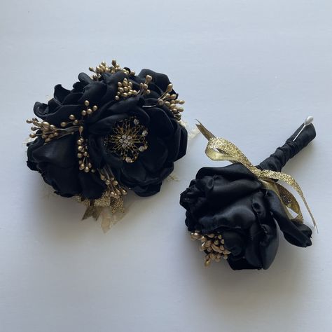 Black And Gold Wrist Corsage, Black And Gold Prom Flowers, Black Dress Corsage Ideas, All Black Corsage, Black And Gold Tuxedo Prom, Black And Gold Corsage And Boutonniere, Prom Flowers Black Dress, Black And Gold Boutonniere, Black Suit With Gold Accents