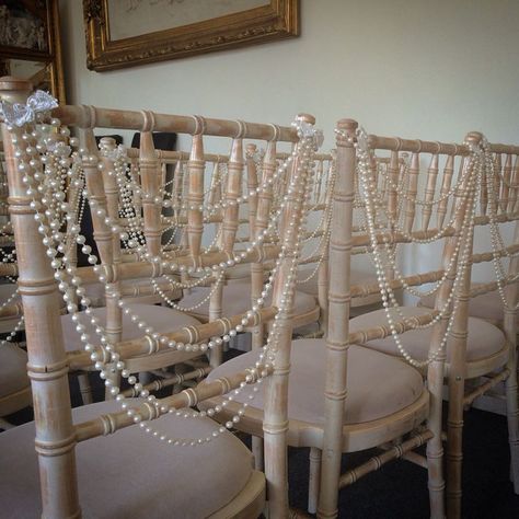 Chandelier With Pearls, Pearls And Crystals Wedding Decor, Pearls Decorations Wedding, Wedding Table Decorations Pearls, Fall Wedding With Pearls, Hanging Pearls Decor, Pearl Wedding Theme Color Schemes, Lace And Pearls Wedding Decorations, Beaded Wedding Decor