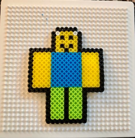 Roblox noob perler beads Perler Beads Roblox Patterns, Kandi Patterns Perler Beads, Aesthetic Melty Beads, Roblox Perler Bead Patterns, Roblox Perler Beads, Iron Beads Ideas Aesthetic, Tyler The Creator Perler Beads, Funny Perler Beads, Roblox Crafts