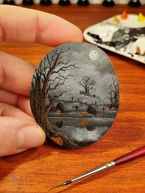 Painting of a graveyard Halloween Graveyard Painting, Landscape Rock Painting Ideas, Headstone Painting, Rock Art Halloween, Cemetery Painting, Graveyard Painting, Autumn Acrylic Painting, Graveyard Art, Tiny Paintings