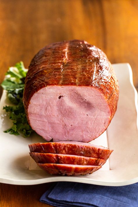 Learn how to cook a whole, boneless ham with the best glaze. It's an easy option for entertaining because they come pre-cooked. All you do is add flavor. #ham #holidayham #bonelessham via @cookthestory Best Boneless Ham Recipe, Boneless Precooked Ham Recipes, How To Cook A Boneless Ham In The Oven, Precooked Boneless Ham In Oven, Already Cooked Ham Recipes, Easter Boneless Ham Recipes, Baked Boneless Ham Recipes Oven, Ham Roast Recipes Ovens, How To Cook A Boneless Ham