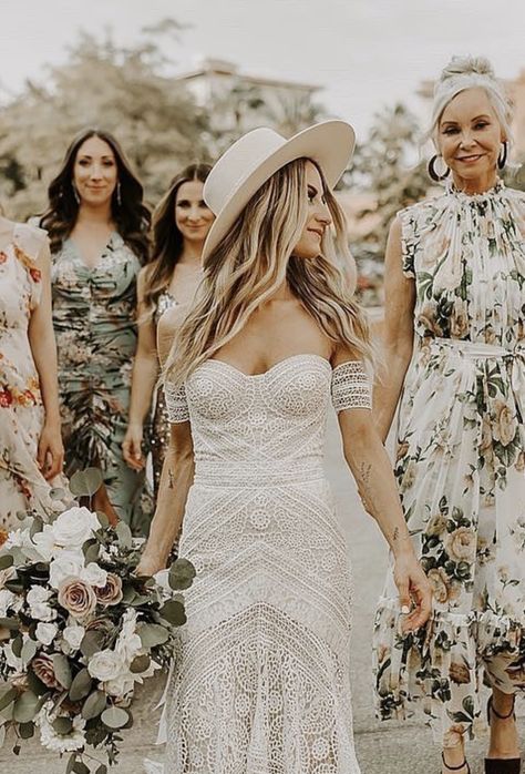 More prints, please! 🌸 Real bride Natalie's bride BABES wore a mix of floral patterns that perfectly complemented the lace of her Rue De Seine 'Ash' gown from Lovely Bride LA. Photo: By Amy Lynn | boho wedding dress, wedding dress with arm bands, crochet wedding dress #lovelybride #weddingdress Bride Hat Boho, Boho Wedding Hats For Bride, Wedding Hair With Hat, Boho Wedding Hat, Wedding Hats For Bride, Wedding Dress With Hat, Bride With Hat, Crochet Wedding Dress, White Bohemian Dress