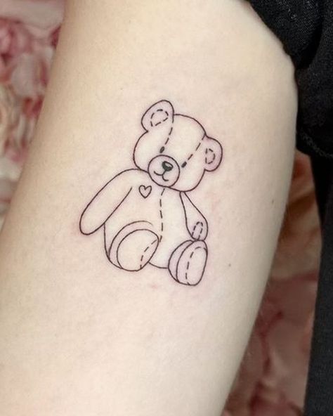 Discover the power of symbolism of bear tattoos. From realistic to minimalist designs, get your perfect bear tattoo inspiration. Teddy Bear Memorial Tattoo, Teddy Bear Line Tattoo, Bear Fine Line Tattoo, Fine Line Teddy Bear Tattoo, Teddy Bear Outline Tattoo, Teddy Bear Tattoo Ideas For Women, Tedy Tattoo, Stuffed Bear Tattoo, Teddy Bear Line Art