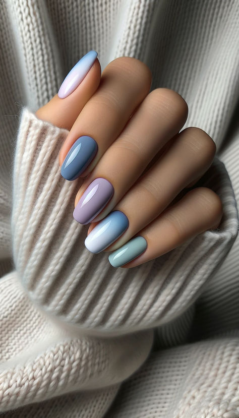 Capturing the essence of a serene winter morning, this nail art beautifully blends pastel shades of blue, lavender, and gray. The soft gradient on each nail mimics the tranquil hues of a wintery sky at dawn. Paired against the backdrop of a cozy knitted sweater, this mani effortlessly combines warmth and elegance, making it perfect for both relaxed weekends and stylish outings. A sophisticated way to embrace winter's gentle colors. 🌫️💅 #CozyPastelPalette #WinterElegance Lavender Blue Nails, Lavender Gel Nails, Blue Pastel Nails, Peace Nails, Pastel Color Nails, Nail Color Combinations, Bright Nail Art, Nails Styles, Nails Inspiration Summer