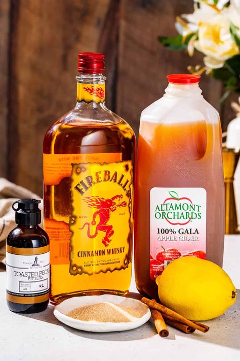 This Fireball Apple Cider is the perfect fall cocktail! Easy to make, super tasty and with the perfect apple cinnamon flavor that autumn is all about. Fireball is a cinnamon whiskey that pairs perfectly with fresh apple cider in this simply delicious drink recipe. Drinks Using Apple Cider, Boozy Apple Cider Drinks, Cider Fireball Cocktail, Fall Fireball Drinks, Apple Cinnamon Whiskey, Fireball Apple Cider, Fireball Whiskey Drinks, Fireball Cider, Hard Apple Cider Recipe