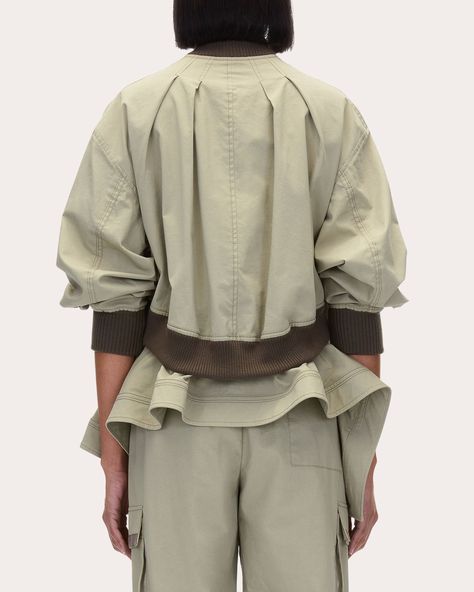 A dynamic approach to utilitarian aesthetics, this Phillip Lim bomber jacket is designed with a faux-layered bodice to create the illusion of an asymmetric handkerchief drape layered under the ribbed hem. The pleated neckline and zipped side vents emphasize the silhouette's dimensional shape. Zip and button closure Pleated neckline Dropped shoulders Faux layered bodice Asymmetric handkerchief hem Topstitched seams Contrast ribbed trim Side-zip vents Side pockets 60% cotton, 37% viscose, 3% elast Pleated Neckline, Long Sleeves Coats, Handkerchief Hem, Long Sleeves Jacket, Phillip Lim, Brown Beige, Layers Design, Zip Jacket, Casual Jacket