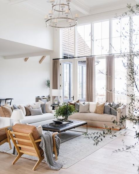 C H E L L + C H A D on Instagram: "One of our favorite and most requested things we do when designing for our clients is add a large bank of windows and doors to their family living area, that provides for gorgeous outdoor views and ample natural light. Design+build @cambridgehomecompany Photo @rebekahwestoverphotography" Soothing Living Room Decor, Tall Ceiling Living Room Lighting, Living Room With Tall Windows, Vaulted Ceiling Living Room Curtains, Light And Airy Living Room Ideas, Living Room With Wall Of Windows, 12ft Ceilings Living Room, High Windows Living Room, Tall Windows Living Room High Ceilings