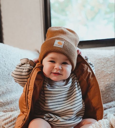 Baby wearing striped sweater and puffer vest with brown carhartt beanie sitting inside of an RV. Thanksgiving outfit and fall outfit idea. Carhartt Beanie Baby, Newborn Flannel Outfit, Carhartt Baby Outfits, Baby Carhartt Beanie, Brown Beanie Outfit, Brown Carhartt Beanie, Baby Boy Thanksgiving Outfit, Baby Carhartt