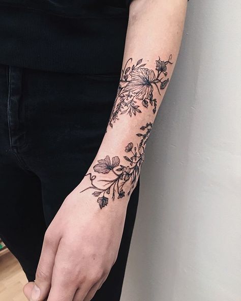 🌿🍃 tiny vines and grasses ••••• #ygtattooing #gyachyaana #linework #dotwork #blacktattoo #tattoo #tattoos #uk #london #londontattoo… Wildflower Wrap Around Tattoo, Botanisches Tattoo, Arm Wrap Tattoo, Flower Vine Tattoos, Wrap Around Wrist Tattoos, Floral Arm Tattoo, Skull Sunflower, Around Arm Tattoo, Wrap Around Tattoo