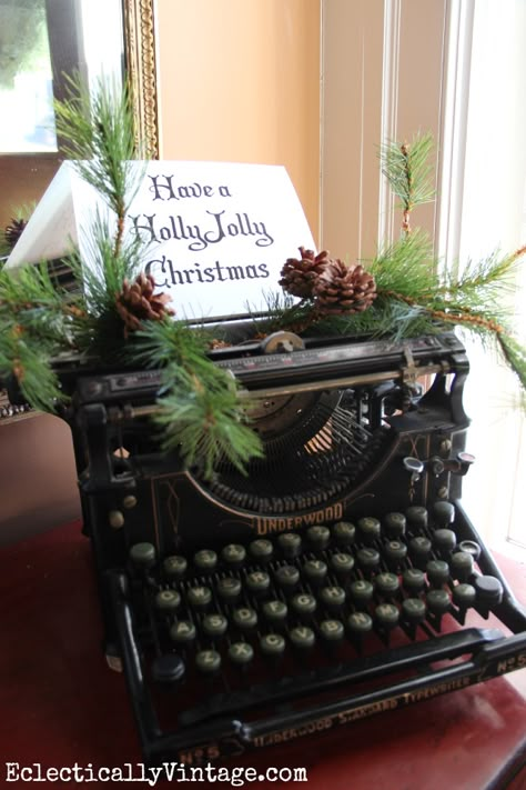 Have a Holly Jolly Christmas - vintage Underwood typewriter is a fun way to decorate kellyelko.com Natal Country, Underwood Typewriter, Christmas House Tour, Have A Holly Jolly Christmas, Christmas Lodge, Antique Booth, Holly Jolly Christmas, Farmhouse Holiday, Christmas Interiors