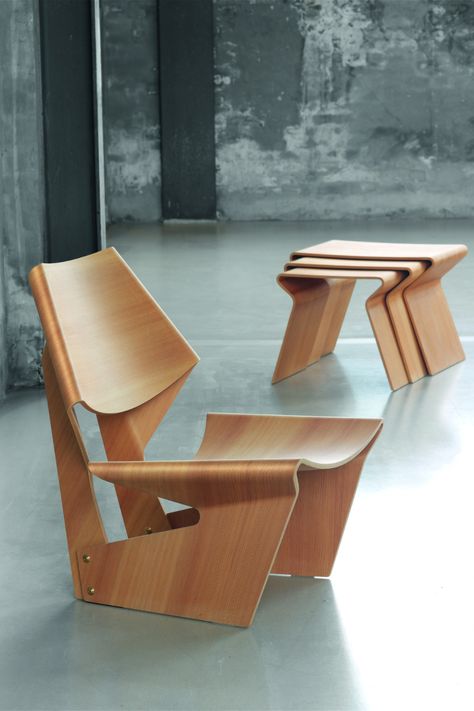 Shop suiteny.com for the GJ Bow Chair by Grete Jalk. The GJ Chair was designed by Grete Jalk in 1963 and is today regarded as the Danish designer's best-known work. The chair, for which Jalk also created a companion side table, was realized in collaboration with the cabinetmaker Poul Jeppesen. Plywood Chair, Console Design, Wooden Chairs, Unique Chair, Plywood Furniture, Creative Furniture, Take A Seat, Nesting Tables, Wooden Chair