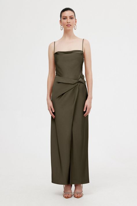 An elegant silhouette, designed to move with the wearer. The Esme Maxi Dress in Olive is crafted from our soft touch satin fabrication. Subtle cowl neckline, draping detail at the waist, accentuated split and spaghetti straps. A great option for bridesmaids. PRODUCT DETAILS - Midi dress - Unlined - Invisible back zip - Split - Adjustable straps Model is 177cm / 5’9” wearing an 8AU / 4US Composition: 62% Viscose Rayon, 38% Polyester CARE INSTRUCTIONS This fabric has been specially woven. Because Dresses Illustration, Celine Fashion, Hunny Bunny, Drape Dress, Olive Green Dresses, Viscose Rayon, Delicate Design, Cowl Neckline, Draped Dress