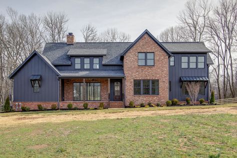 Black Siding Exterior With Brick, Transitional Farmhouse Exterior, Brick And Siding Exterior Combinations, All Black House Exterior, Iron Ore Sherwin Williams, Black Modern Farmhouse, Red Brick Exteriors, Industrial Exterior, Mountain Home Exterior