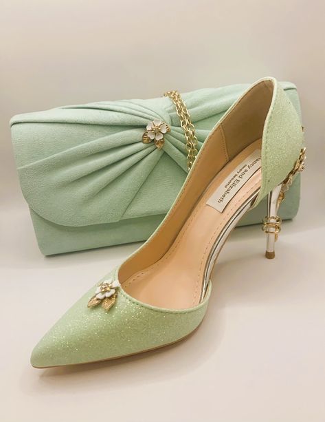 Stunning Hand Finished Mint Green Glitter Flower Feature Heel Shoes with Mint Green Soft Finish Co-ordinating Clutch Bag Set Beautiful Sparkling Glitter Mint Green Mix Shoes with Flower Feature Heel and Front with Co-ordinating Mint Green with Gold Clutch Bag Very Elegant Set Perfect Wedding Day Shoes and Matching Clutch Bag with Gold Chain  Shoes are Approx. 10cm High for Elegance Perfect for Comfort Size Approx. 27cm x 14cm x 7cm Sizes: UK 3-8 (EU 36-43) Gold Shoes Green Dress, Green Heels Outfit, Sweet 16 Shoes, Mint Green Heels, Mint Heels, Chain Shoes, Pista Green Colour, Earth Fairy, Gold Clutch Bag