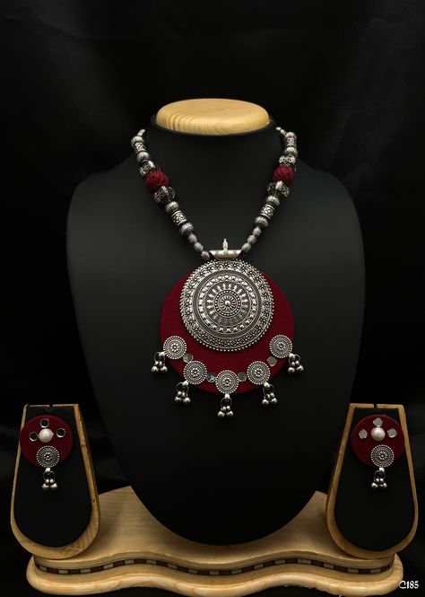 🌿 Style: Boho Chic💎
 Materials: High-quality metal alloys and fabric accent.
🎉 Occasion: Festivals, cultural events, casual outings.

Embrace bohemian beauty with this stunning statement jewelry set! Featuring intricate silver detailing and rich red accents, this necklace and earring duo is perfect for festivals, cultural events, or making a bold fashion statement. Fabric Jewelry Necklace, Boho Necklace Diy, Fabric Jewelry Handmade, Jewellery Patterns, Diy Jewelry Making Bracelets, Diy Jewellery Designs, Bohemian Beauty, Fabric Jewellery, Making Bracelets