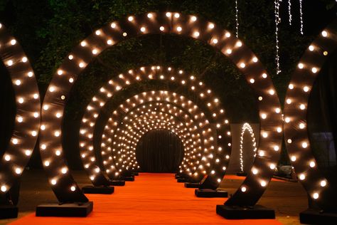 Wedding sangeet entry passage Sangeet Entry Gate, Sangeet Entry, Sangeet Decoration, Tunnel Entrance, Marriage Hall, Carnival Night, Wedding Layout, Sangeet Decor, Hall Entrance