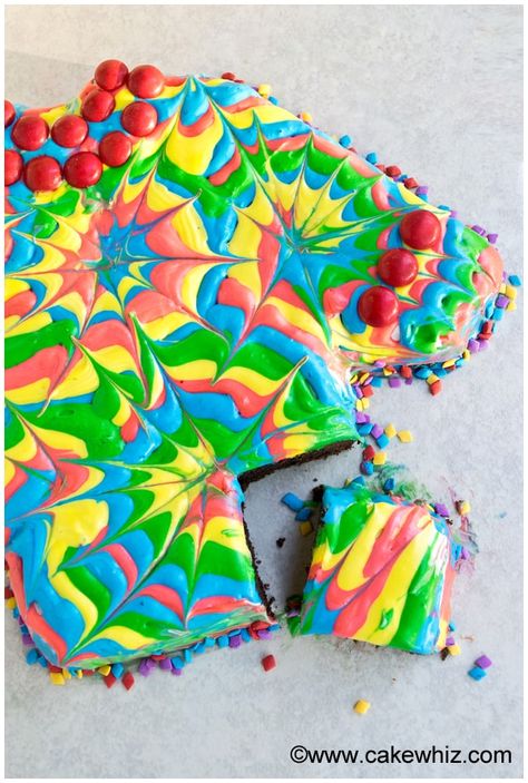 Learn how to make a tie dye cake (shirt cake), using this step-by-step tutorial. Easy to make with rainbow colored frosting and toothpicks! Great for Father's Day! If you remember this Shirt Cake from a few years ago, today's version is just a different spin on it. It uses an ugly sweater cake pan instead of a round cake pan and the decorations are done with frosting instead of fondant. You don't need any fancy tools or equipment to decorate this cake. All you need is rainbow colored ... Tye Dye Icing How To Make, Tie Dye Buttercream Frosting, Tie Dye Frosting, Cake Mix Homemade, Tye Dye Cake, Ugly Sweater Cake, Sweater Cake, Easy Tie Dye, Tie Dye Cake