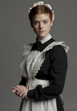 Gwen Dawson (Rose Leslie), is an under-housemaid,the daughter of a farm hand, who cherishes a dream to become a secretary. She is helped considerably by Lady Sybil Crawley who believes in women making a life for themselves. Servant Dress, Downton Abbey Season 1, Downton Abbey Cast, Lady Sybil, Rose Leslie, Downton Abbey Fashion, Downton Abby, Maid Uniform, Lady Mary