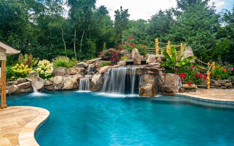 Aquatic Artists designed and built the ultimate backyard oasis with multiple water features that flow into this custom gunite pool in Williamstown, NJ.  First, we crafted a custom waterfall grotto cave that is 8 feet wide and 16 feet deep and is made of all natural stone.  The grotto cave is half wet and half […] Waterfall Grotto, Pool Waterfalls, Spa Waterfall, Water Feature Lighting, Grotto Pool, Insane Pools, Belgard Pavers, Rock Floor, Ultimate Backyard