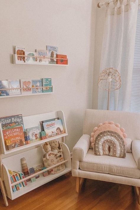 Bookshelf Under Window Nursery, Small Nursery Book Storage, Nursery Book Display, Book Shelf Nursery Ideas, Nursing Nook Ideas, Nursery Book Nook, Book Storage In Nursery, Nursery Bookcase Ideas, Nursery Corner Ideas