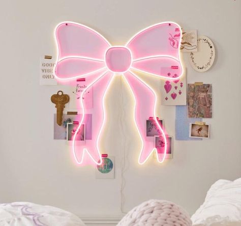 This eye-catching piece features your choice of pink or white LED bulbs forming a glowing bow silhouette, adding a magical touch to any room.  It's constructed from durable iron, plastic, and LED lights, ensuring longevity.  Easy to install with included mounting hardware and powered by a simple plug-in connection at 5 volts, it's both energy-efficient and enchanting. Room Decor Bedroom Pink And White, Led Room Signs, Preppy Led Lights, Cute Led Lights, Preppy Lights, Pink Decor For Room, Cute Room Ideas Preppy, Cute Room Decor Night Lights, Aesthetic Pink Room Decor