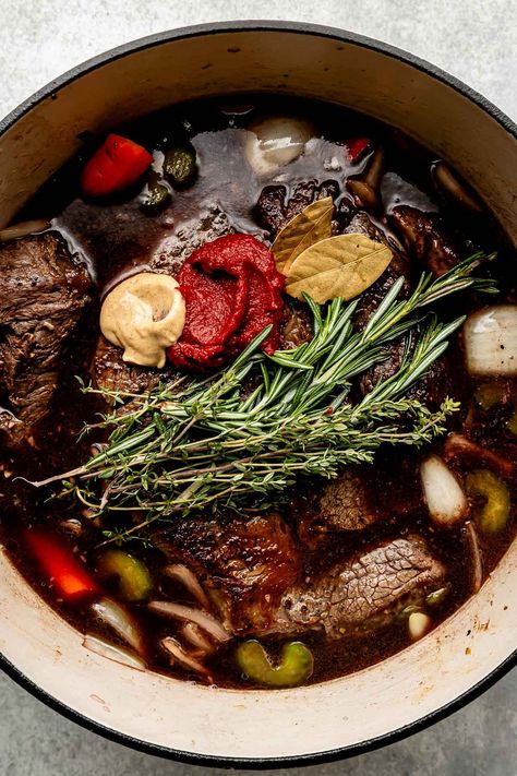 You don't need an expensive cut of beef to make a restaurant-worthy meal – this Red Wine Braised Beef recipe is proof! Slowly simmer beef chuck roast with red wine, vegetables, & herbs until it transforms into a succulent centerpiece complete with a built-in red wine sauce. Serve with creamy mashed potatoes for the best cozy dinner! (Slow cooker/Crockpot & Instant Pot directions provided.) #redwinebraisedbeef #redwinebeefroast #braisedbeef ##braisedbeefroast #beefroast #beefrecipes #dinnerideas Boston Beef Roast Recipes, Roast Beef With Red Wine Gravy, Red Wine Beef Roast, Cooking Chuck Roast, Roast With Red Wine, Red Wine Braised Beef, Wine Braised Beef, Chuck Roast Crock Pot Recipes, Dinner Slow Cooker