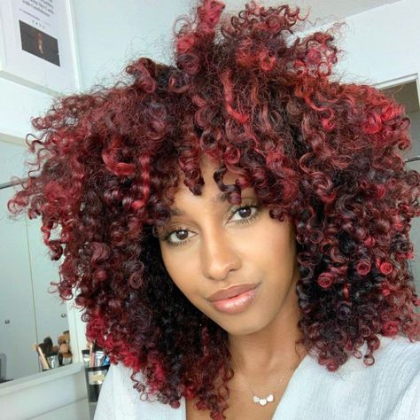 Curious about trying red highlights? Inside, we share red looks that complement a variety of skin tones and talk with a professional colorist for her best tips. Cabello Afro Natural, Dark Curly Hair, Dyed Curly Hair, Highlights Curly Hair, Bold Hair Color, Red Curly Hair, Dark Red Hair, Colored Curly Hair, Dyed Natural Hair