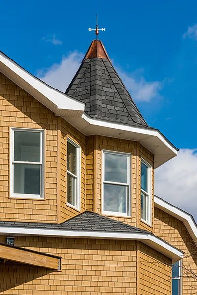 Beach House Shake in Sandcastle | Tando Building Products Vinyl Shingle Siding Exterior, Vinyl Shingle Siding, Shingle Siding, Cedar Shingles, Gable Roof, Stately Home, Industrial Buildings, Cost Saving, Exterior Siding