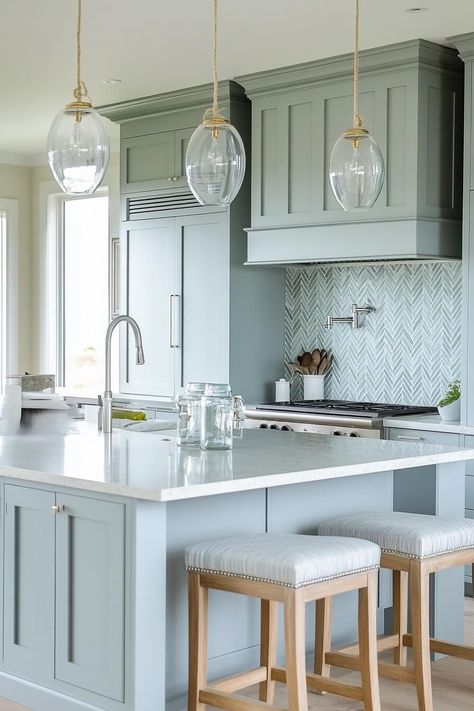 blue cabinets with blue backsplash in coastal kitchen Seafoam Blue Kitchen, Kitchen Backsplash Ideas For Blue Cabinets, Beach Glass Kitchen Cabinets, Santorini Blue Cabinets, Aegean Teal Cabinets, Sea Salt Kitchen Island, Pale Blue Cabinets Kitchen, Coastal Cabinet Colors, Sea Salt Kitchen Cabinets