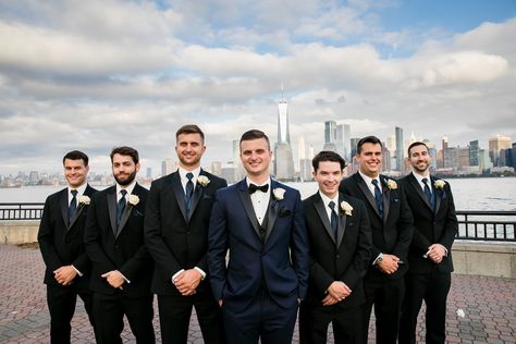 Groom Navy Tux Groomsmen Black, Navy Blue And Black Groomsmen Suits, Deep Blue Tuxedo Wedding, Black Bridesmaid Dresses Navy Groomsmen, Groomsmen Attire Black And Blue, Navy Groom Black Groomsmen, Midnight Blue Tuxedo Wedding Groomsmen, Navy And Black Tuxedo, Blue And Black Groomsmen