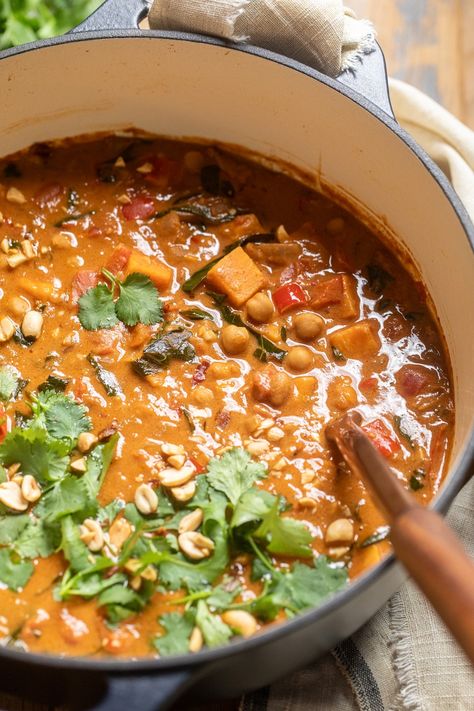 close up of vegan west african peanut stew in a large pot. West African Peanut Stew, Peanut Stew Vegan, West African Peanut Soup, African Peanut Soup, African Stew, Stew Vegan, African Peanut Stew, Peanut Stew, Peanut Soup