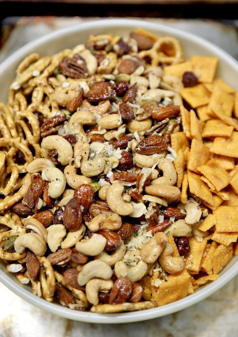 Cheez-It Snack Mix is the ultimate party snack mix made with Cheez-It crackers, salty pretzels and mixed nuts with a tasty garlic ranch seasoning. Easy to make ahead to feed a crowd. Cheeze Its Seasoned, Snacks With Cheerios, Snack Mix Recipes Savory, Spicy Chex Mix, Salty Pretzels, Ranch Crackers, Homemade Cheez Its, Seasoned Nuts, Party Mix Snacks